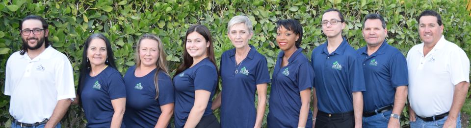The Holiday Home Services team in navy and white company shirts